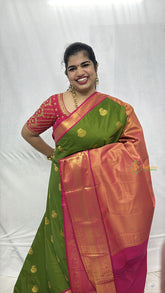 Vriksham Parrot Green With Gold Butta & Veldhaari Pink Zari Border Kanchi Silk Saree-VS4771